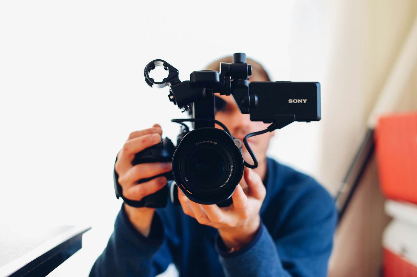 Person Holding Camera - Corporate Training Videos