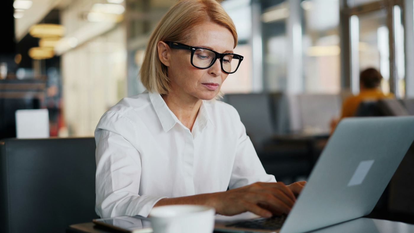 woman on a laptop - How to Create Training Modules