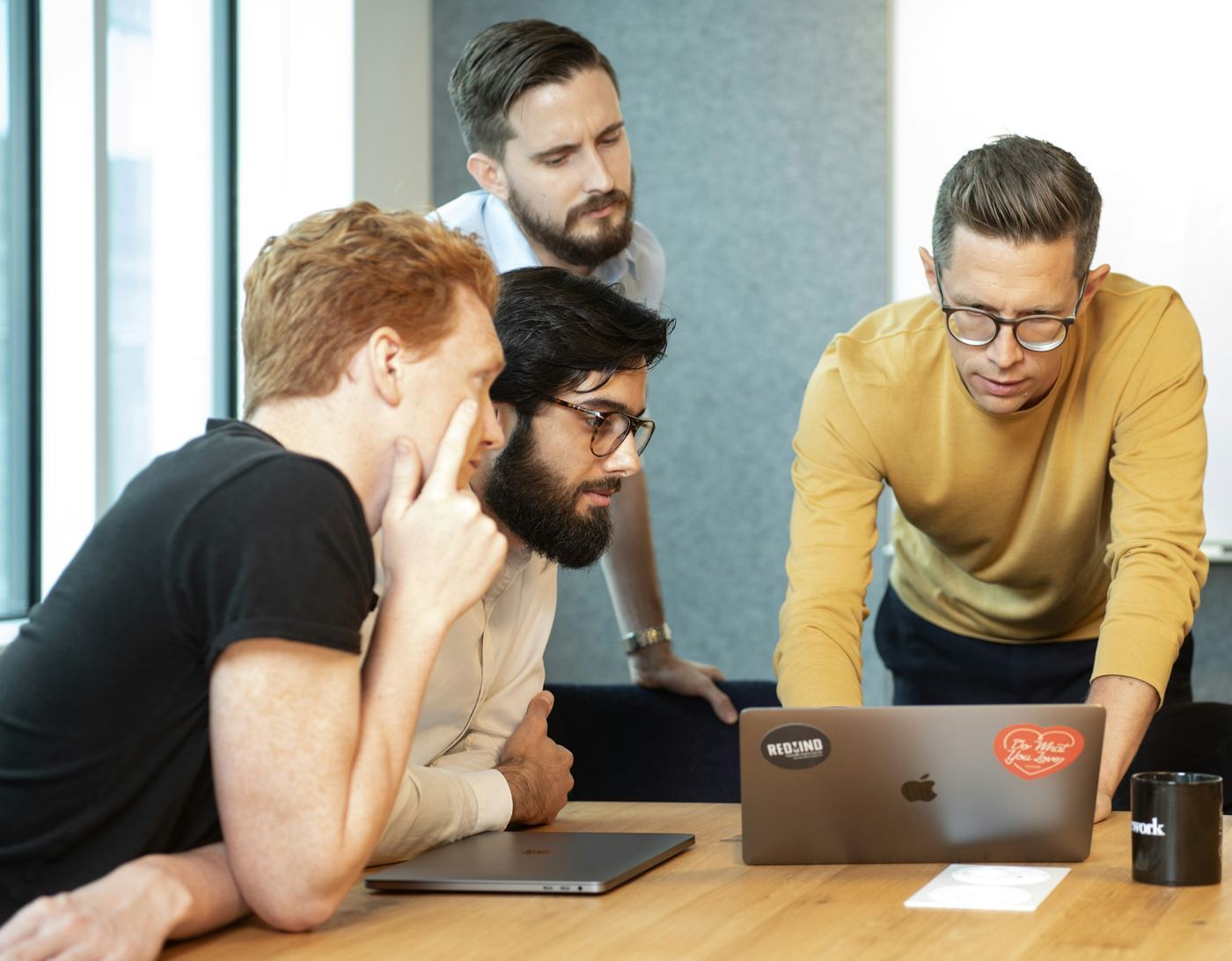 employees on a laptop - How Long is the Average Commercial