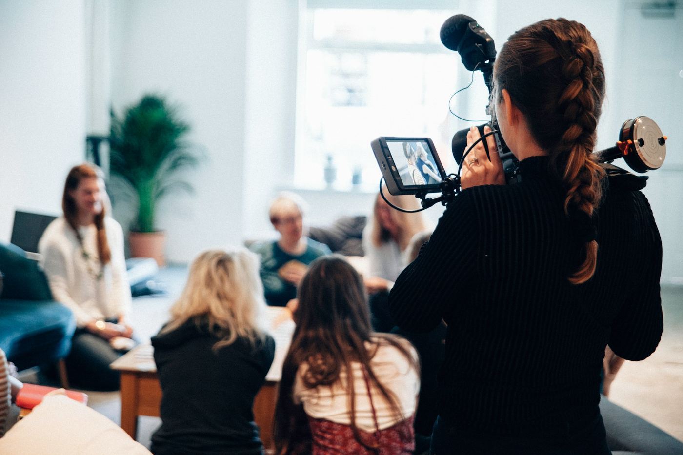 woman using a camera - How to Make Educational Videos