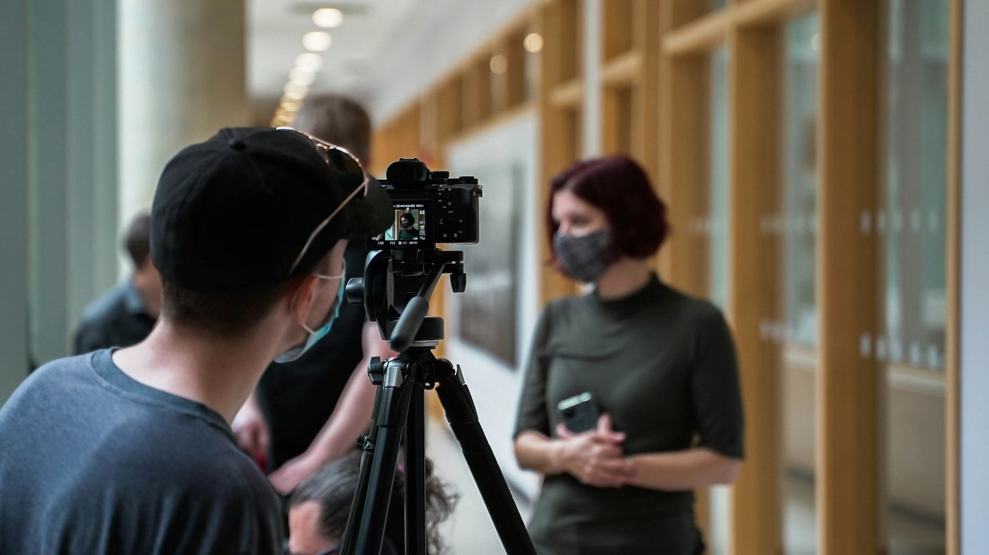 man shooting a video - Types of Corporate Videos