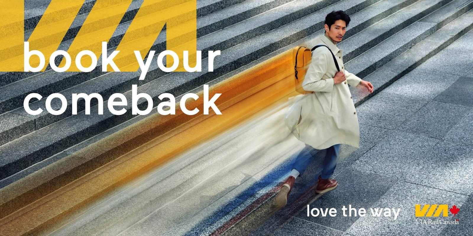 A man in a light trench coat strides across stone steps leaving a yellow and blue motion-blur trail behind him, with the words book your comeback over a yellow VIA shape and the tagline love the way