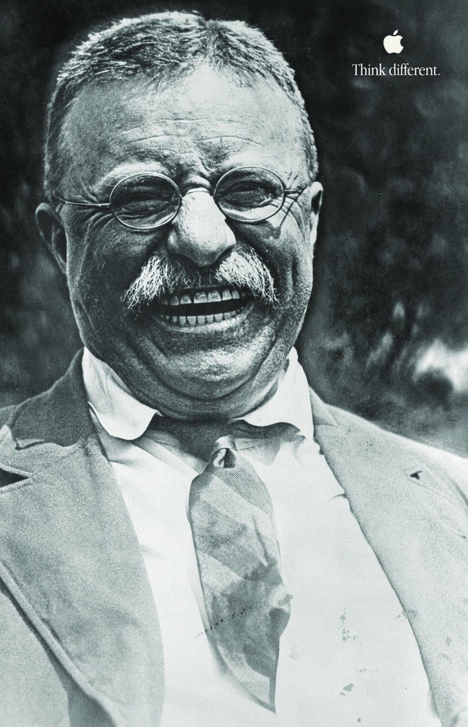 An Apple Think Different poster showing a black and white portrait of Theodore Roosevelt with a small Apple logo