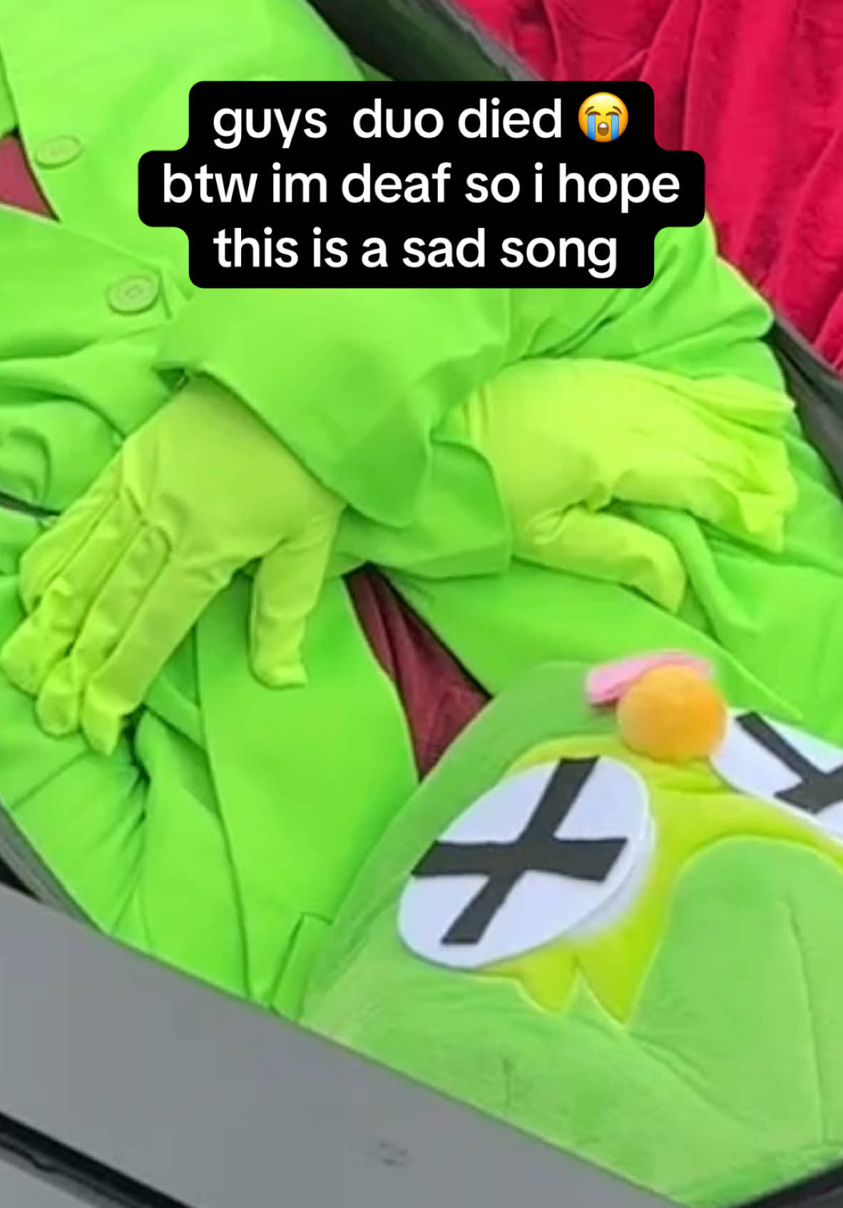 Duolingo's RIP Duo TikTok post showing the Duo mascot lying lifeless with X eyes