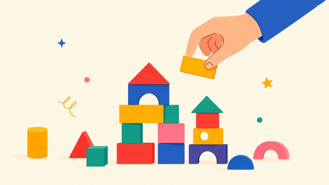 A hand placing a yellow wooden block onto a colorful toy castle built from various geometric shapes.